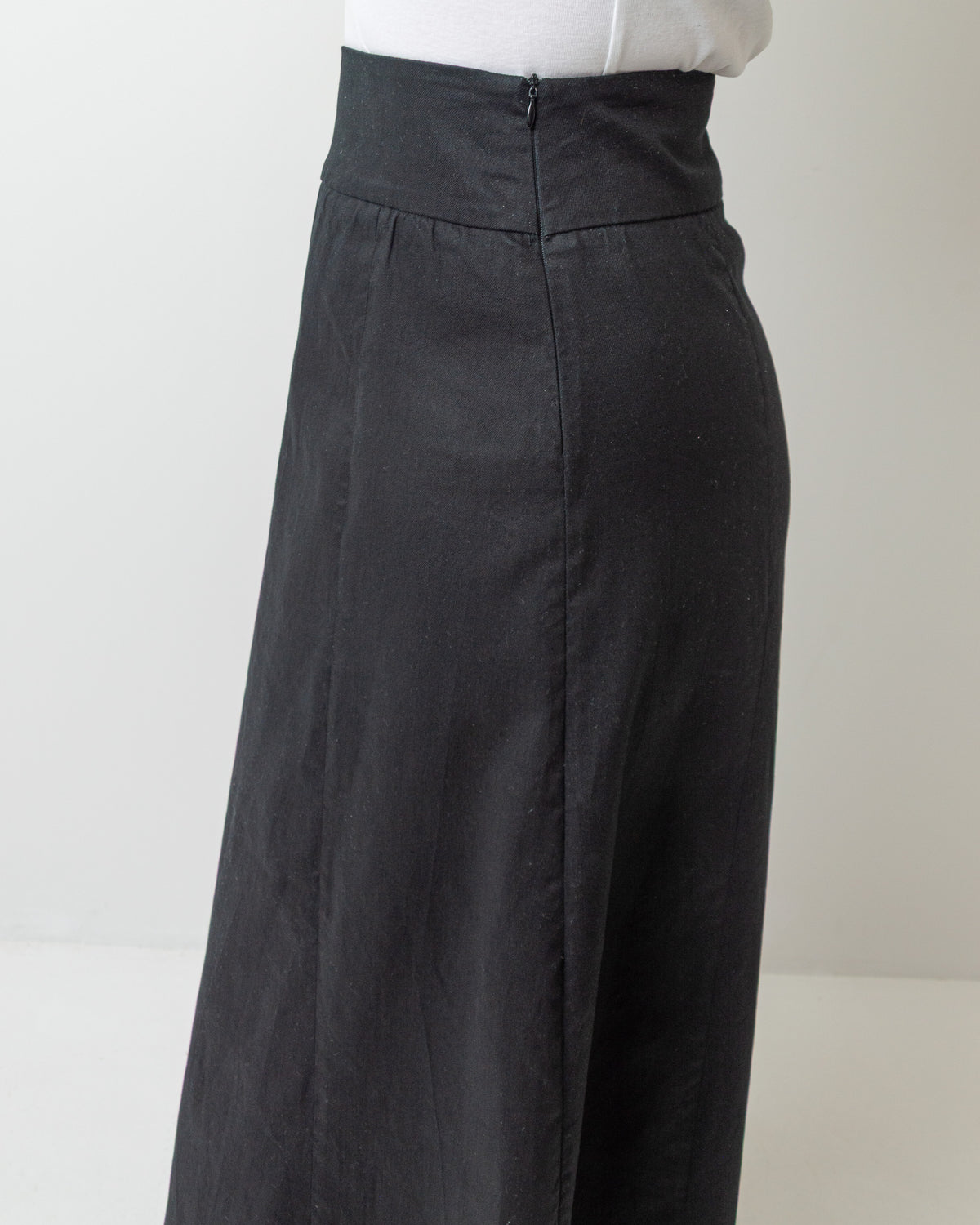 Wittenfelt Black A-Line Maxi Skirt, side view showing high waist and side zip